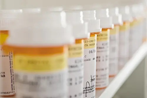 Close-up of containers with printed product labels and barcodes used for identification